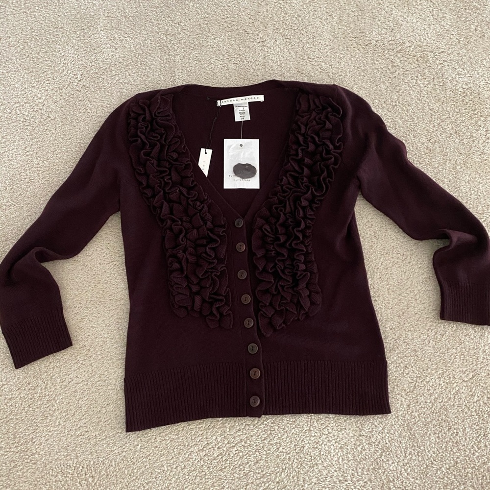 Burgundy v-neck cardigan sweater, a color for Fall 2025.